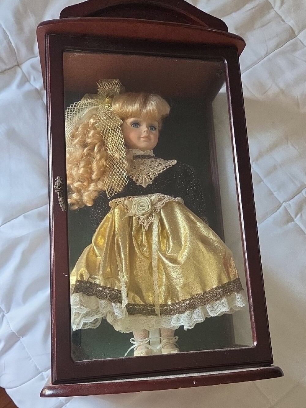 Vintage Navy and Gold Porcelain Doll In Display Cabinet